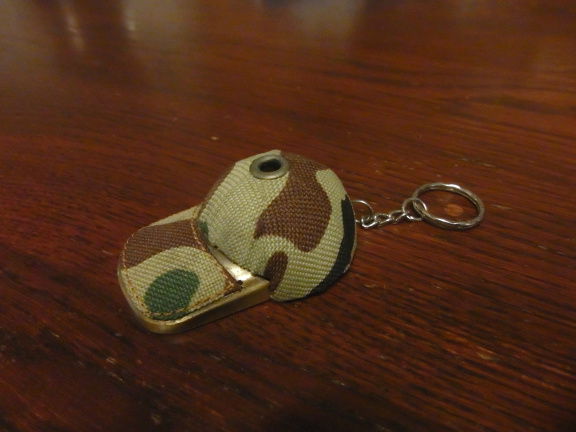 Militaire cap als aansteker. (15). - nr. 1