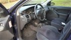 Ford Focus Wagon - 1.8-16V Ghia VERKOCHT - 1 - Thumbnail