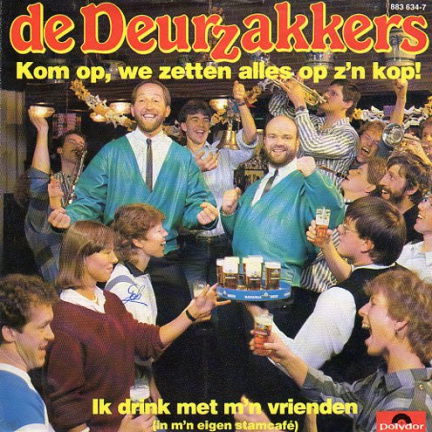 De Deurzakkers – Kom Op, We Zetten Alles Op Z'n Kop! (1985) - nr. 1