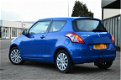 Suzuki Swift - 1.2 Exclusive / zeer netjes / Cruise / Clima - 1 - Thumbnail