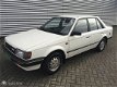 Mazda 323 - 1.5 LX SEDAN LPG VASTE EXPORTPRIJS € 750, - EX BTW - 1 - Thumbnail