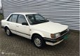 Mazda 323 - 1.5 LX SEDAN LPG VASTE EXPORTPRIJS € 750, - EX BTW - 1 - Thumbnail