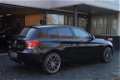 BMW 1-serie - 116i Executive Navi|Clima|Cruis|PDC 136PK Zwart Metallic - 1 - Thumbnail