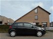 Opel Corsa - 1.4-16V Edition 1.4 AUTOMAAT, 5-D AIRCO/STOELVERW./STUURVERWARMING - 1 - Thumbnail