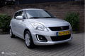 Suzuki Swift - - 1.2I 94PK 5 drs. Comfort airco/cruiscontrole/lmv15 - 1 - Thumbnail