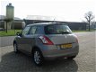 Suzuki Swift - 1.2 Dynamic EASSS bj.2015, 145.000km, btw auto, inr.mog - 1 - Thumbnail