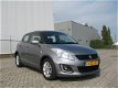 Suzuki Swift - 1.2 Dynamic EASSS bj.2015, 145.000km, btw auto, inr.mog - 1 - Thumbnail