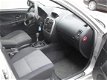 Mitsubishi Carisma - 1.6 Comfort Drive, dealer onderhouden - 1 - Thumbnail