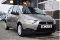 Mitsubishi Colt - 1.1 Inform 5 deurs - 1 - Thumbnail