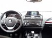 BMW 1-serie - 114i High Executive M-Sport (navi, xenon, sportstoelen) - 1 - Thumbnail