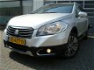 Suzuki S-Cross - EXCLUSIVE HOGE INSTAP AUTOMAAT CLIMA CRUISE KEYLESS 17 INCH LMV DAKRAIL - 1 - Thumbnail