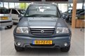 Suzuki Grand Vitara - 2.0 FreeStyle-3 [4X4/TREKHAAK/LEDER/CLIMA/DEALEROH/1850KG TREKGEW] - 1 - Thumbnail