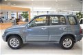 Suzuki Grand Vitara - 2.0 FreeStyle-3 [4X4/TREKHAAK/LEDER/CLIMA/DEALEROH/1850KG TREKGEW] - 1 - Thumbnail