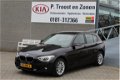BMW 1-serie - 118i Business+ Automaat/Navigatie/Cruise control/Xenon/Pdc/Dealeronderhouden/Afneembar - 1 - Thumbnail