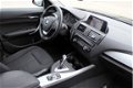 BMW 1-serie - 118i Business+ Automaat/Navigatie/Cruise control/Xenon/Pdc/Dealeronderhouden/Afneembar - 1 - Thumbnail