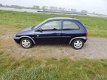 Opel Corsa - 1.2i-16V Strada Nieuwe APK - 1 - Thumbnail