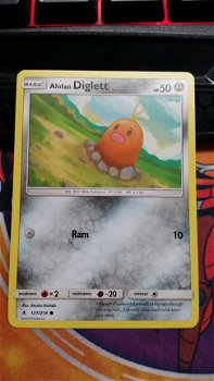 Alolan Diglett 121/214 sm Unbroken Bonds - 1