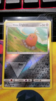 Alolan Diglett 121/214 (reverse) sm Unbroken Bonds - 1