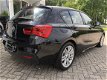 BMW 1-serie - 116i M Sport Pakket NAVIGATIE SPORTSTOELEN XENON PDC V/A ClIMAAT CONTROL - 1 - Thumbnail