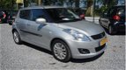 Suzuki Swift - 1.2 Exclusive 5deurs airco cruisct stoelverw 77dkm lm-velgen nw michelen banden zeer - 1 - Thumbnail