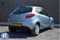 Mazda 2 - 2 1.5 GT-L Automaat / Weinig Km / Airco / LM velgen - 1 - Thumbnail