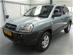 Hyundai Tucson - 2.0i Dynamic AIRCO. CRUISE C. L.M.VELGEN - 1 - Thumbnail