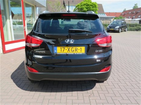 Hyundai ix35 - NAVIGATIE, LEDEREN BEKLEDING, PANORAMA DAK, EXTRA SET WINTERWIELEN, ZEER NETTE STAAT - 1