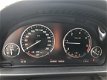 BMW 5-serie Touring - 520d High Executive Adaptieve CC, Headup display, bixenon, active steering - 1 - Thumbnail