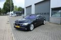 BMW 7-serie - 750Li High Executive Softclose / 4 zone Airco / Rolgordijnen / Camera / Keyless Go - 1 - Thumbnail