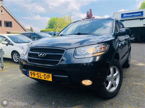 Hyundai Santa Fe - - 2.7i V6 4WD Style 7p. Leder / Navigatie / Climate - 1