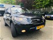 Hyundai Santa Fe - - 2.7i V6 4WD Style 7p. Leder / Navigatie / Climate - 1 - Thumbnail