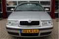 Skoda Octavia Combi - 1.6 Comfort l Airco l Elektr. ramen l PDC l Trekhaak - 1 - Thumbnail