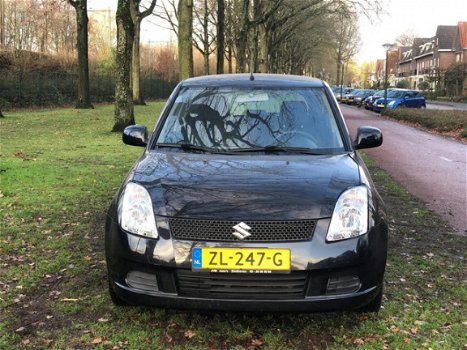 Suzuki Swift - 1.3 Exclusive airco nieuwe apk sportvelgen zeer netjes spoiler - 1