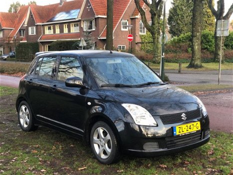 Suzuki Swift - 1.3 Exclusive airco nieuwe apk sportvelgen zeer netjes spoiler - 1