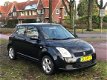 Suzuki Swift - 1.3 Exclusive airco nieuwe apk sportvelgen zeer netjes spoiler - 1 - Thumbnail