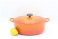 Klassieke ovale gietijzeren pan van Le Creuset, Model D, oranje 27 cm - 1 - Thumbnail