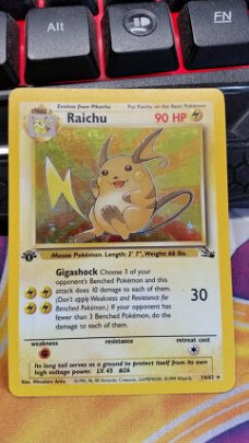 Raichu  14/62  Holo 1ste editie  Fossil  licht gebruikt