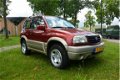 Suzuki Grand Vitara - 2.0 Metal Top Wide Body 4WD*airco*stuurbekr*2de eigenaar - 1 - Thumbnail