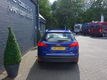 Ford Focus Wagon - 1.0 Titanium 125PK, Airco, Benzine, Cruise Control, Blauw, PDC, Lichtmetalen velg - 1 - Thumbnail