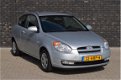 Hyundai Accent - 1.4i Dynamic Joy AIRCO / ELECTRISCHE RAMEN VOOR / PARKEERSENSOREN ACHTER - 1 - Thumbnail