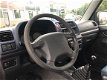 Suzuki Jimny - 1.3 Special 4WD 2002 Airco Low gearing Weinig kilometers - 1 - Thumbnail