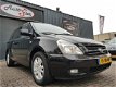 Kia Carnival - 2.7 EX Automaat, 7-Zits, Leder, Cruise - 1 - Thumbnail