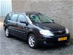 Toyota Corolla Wagon - 1.6 VVT-i Linea Sol - Airco automatisch - Cruise control - Parrot - Trekhaak - 1 - Thumbnail