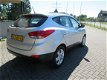 Hyundai ix35 - 1.6i GDI Style [ panodak, fm navi, camera, airco, lmv, audio ] - 1 - Thumbnail