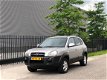 Hyundai Tucson - 2.0i Dynamic Airco, ElektrRamen, Trekhaak etc - 1 - Thumbnail