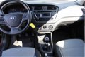 Hyundai i20 - 1.2 HP i-Motion | Rijklaar | Cruise | PDC Achter - 1 - Thumbnail