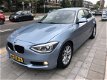 BMW 1-serie - 114i EDE Business+ 5 Deurs, Airco, Leer, Navi - 1 - Thumbnail