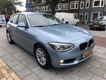 BMW 1-serie - 114i EDE Business+ 5 Deurs, Airco, Leer, Navi - 1 - Thumbnail