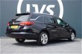 Opel Astra Sports Tourer - 1.4 TURBO Online Edition - CLIMATE - NAVI - AGR STOEL - PARKEERHULP - 1 - Thumbnail