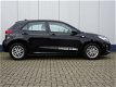 Kia Rio - T-GDI 100PK DYNAMICLINE / NAVIGATIE / CAMERA / CRUISE CONTROL / BLUETOOTH / LM VELGEN / DE - 1 - Thumbnail